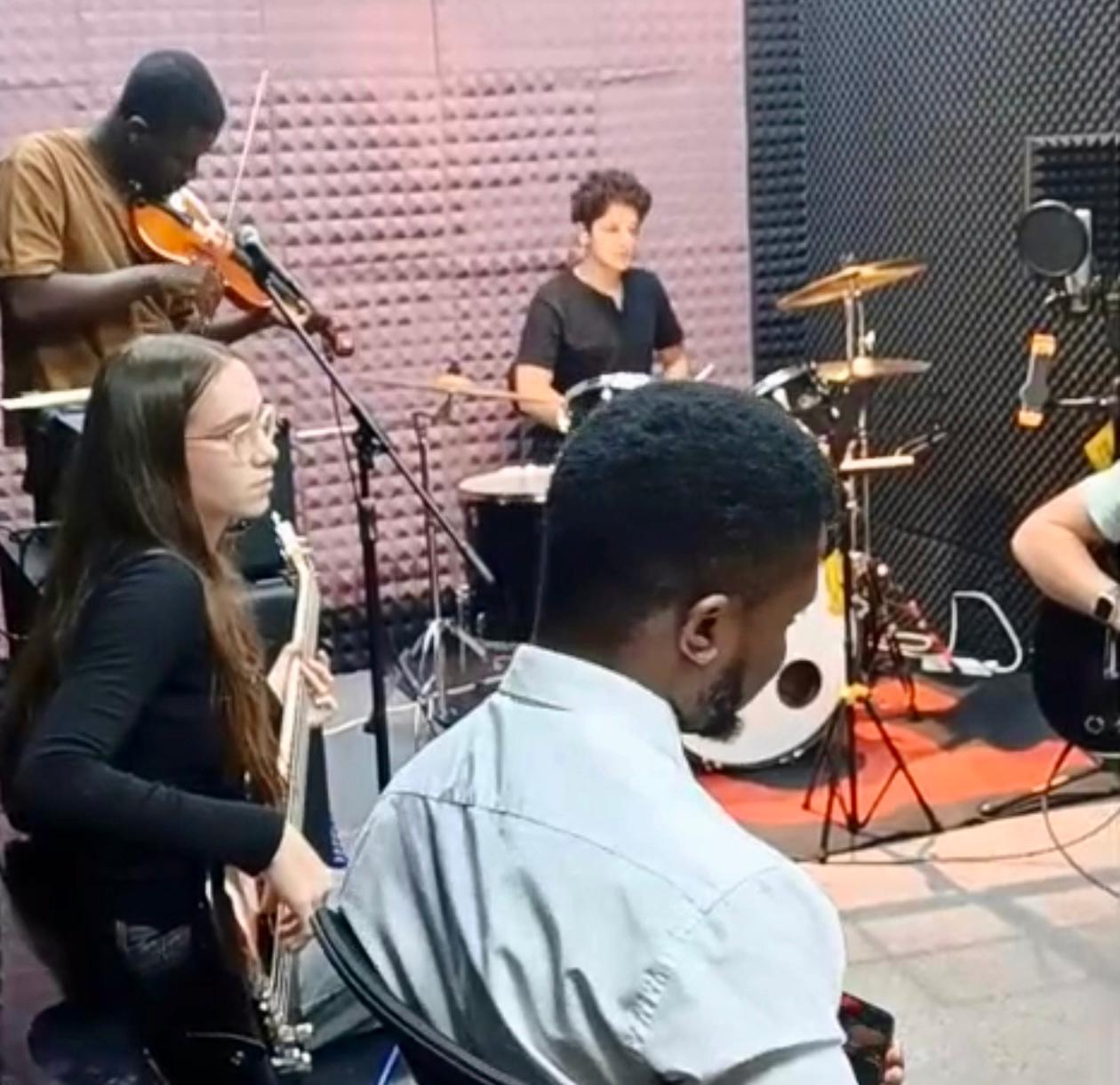 Musicians rehearsing at AKM Music